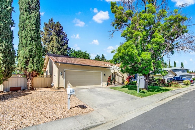 3432 Norwalk Pl, Fairfield, CA 94534 - view of front of home with a tile roof, stucco siding, fence, concrete driveway, and an attached garage