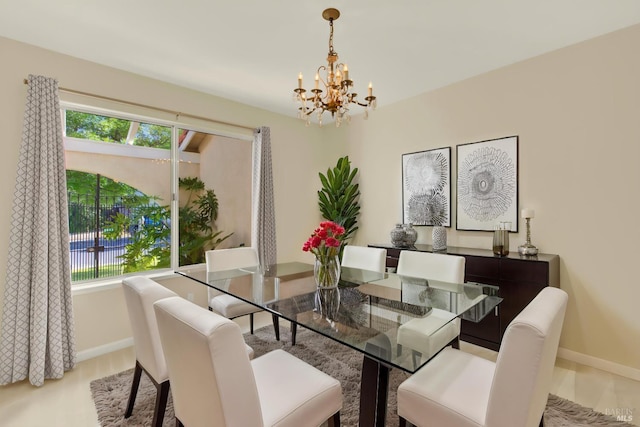 3432 Norwalk Pl, Fairfield, CA 94534 - dining room featuring a chandelier, baseboards, healthy amount of natural light, and light wood-style floors