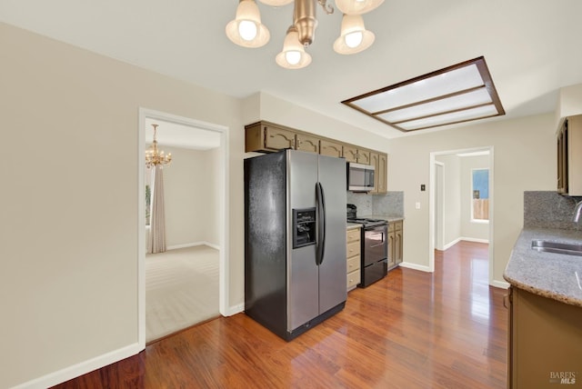 3432 Norwalk Pl, Fairfield, CA 94534 - kitchen featuring appliances with stainless steel finishes, a chandelier, a sink, and wood finished floors