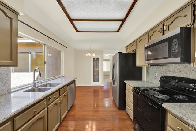 3432 Norwalk Pl, Fairfield, CA 94534 - kitchen with stainless steel appliances, a sink, a chandelier, decorative backsplash, and dark wood-type flooring