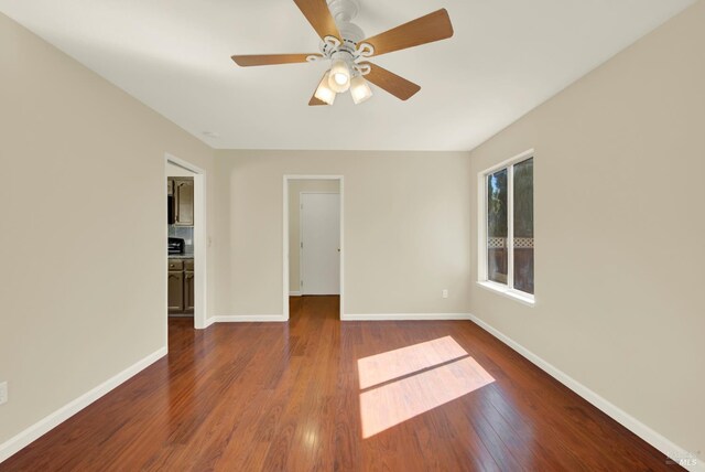 3432 Norwalk Pl, Fairfield, CA 94534 - empty room with baseboards, dark wood-style flooring, and a ceiling fan