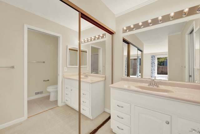 3432 Norwalk Pl, Fairfield, CA 94534 - full bathroom with two vanities, toilet, crown molding, and baseboards