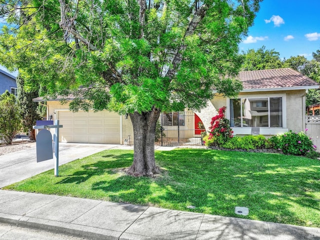 3432 Norwalk Pl, Fairfield, CA 94534 - view of property hidden behind natural elements featuring stucco siding, concrete driveway, a garage, a front lawn, and a tiled roof