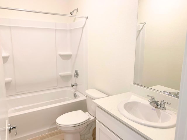 bathroom featuring vanity, shower / bathtub combination, and toilet