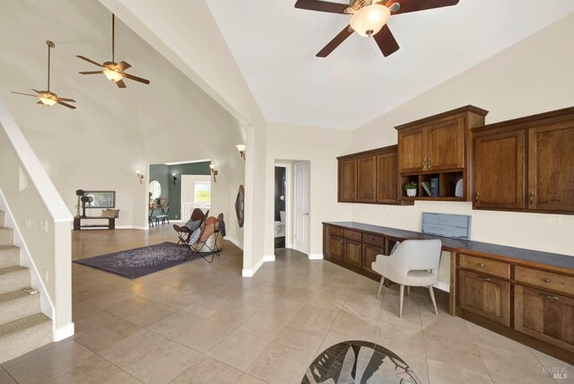 kitchen with ceiling fan, open floor plan, light tile patterned floors, and open shelves