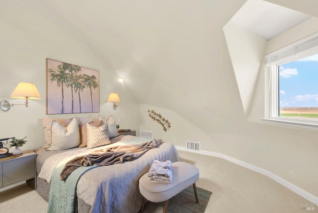 carpeted bedroom with baseboards, visible vents, and lofted ceiling