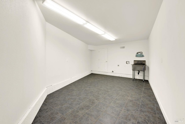 empty room with baseboards and visible vents