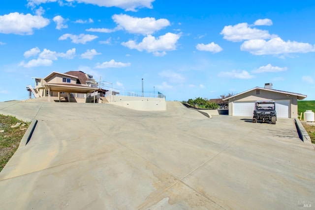 view of road featuring concrete driveway