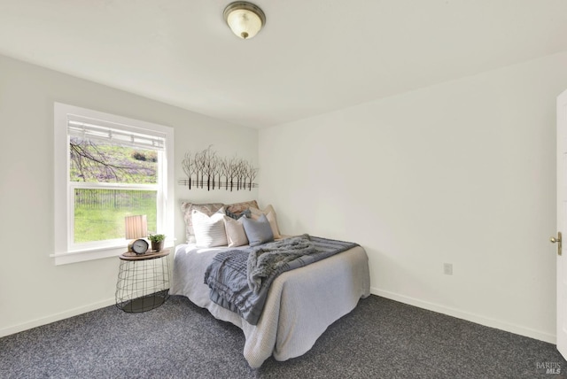 bedroom with carpet floors and baseboards