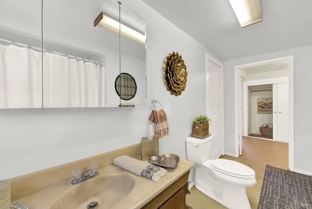 bathroom with toilet, tile patterned floors, a shower with curtain, and vanity