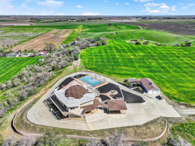 birds eye view of property with a rural view