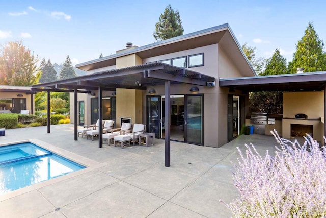 2252 W Dry Creek Rd, Healdsburg, CA 95448 - back of house featuring exterior kitchen, an outdoor living space, a patio, and stucco siding