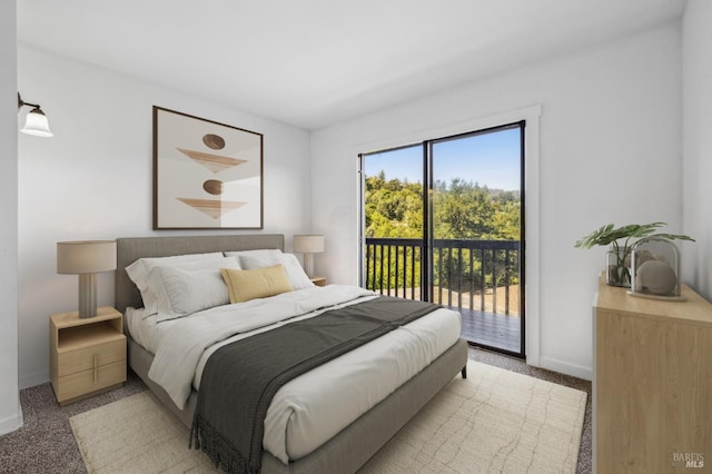 bedroom with light colored carpet, baseboards, and access to exterior