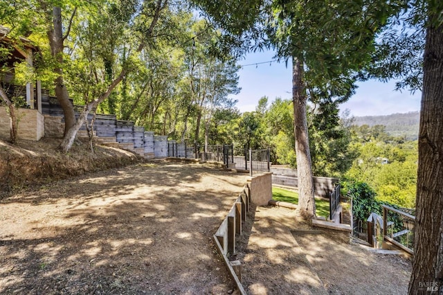 view of community featuring fence