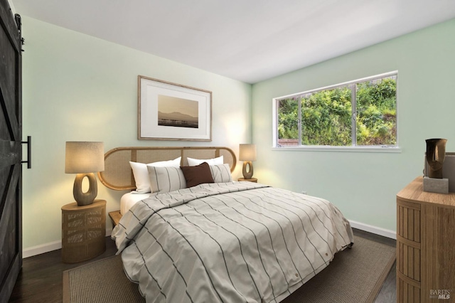 bedroom with dark wood-style flooring and baseboards