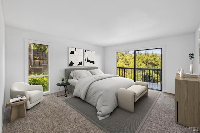 bedroom with carpet floors and access to outside