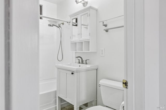 bathroom with toilet, shower / washtub combination, and vanity
