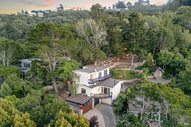 drone / aerial view featuring a forest view