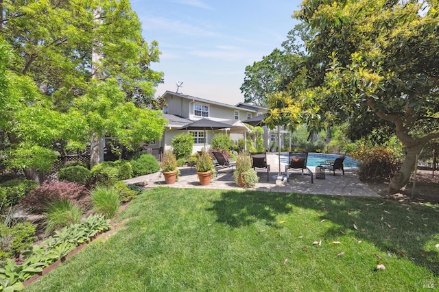 view of yard with a patio and an outdoor pool