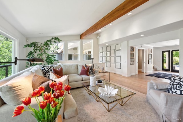 living room with recessed lighting, baseboards, beam ceiling, and wood finished floors