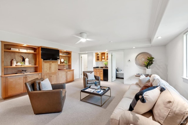 living room featuring recessed lighting, ceiling fan, light carpet, and baseboards