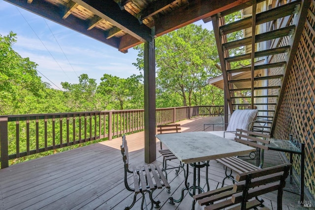 wooden deck with outdoor dining area