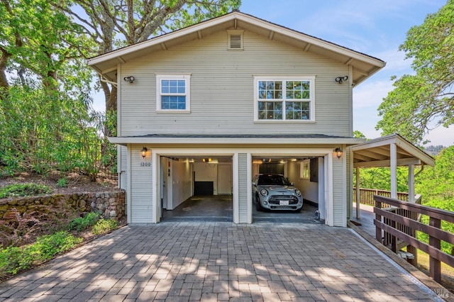 exterior space featuring decorative driveway