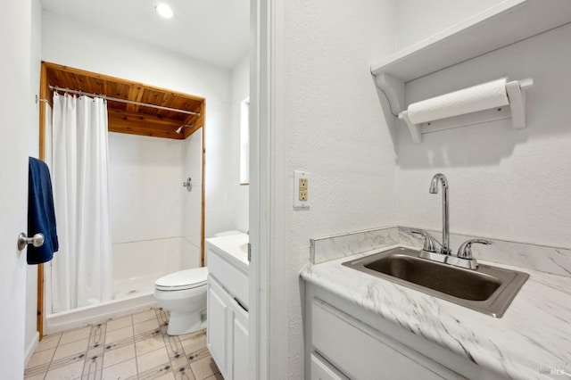 bathroom featuring vanity, tile patterned floors, a stall shower, and toilet