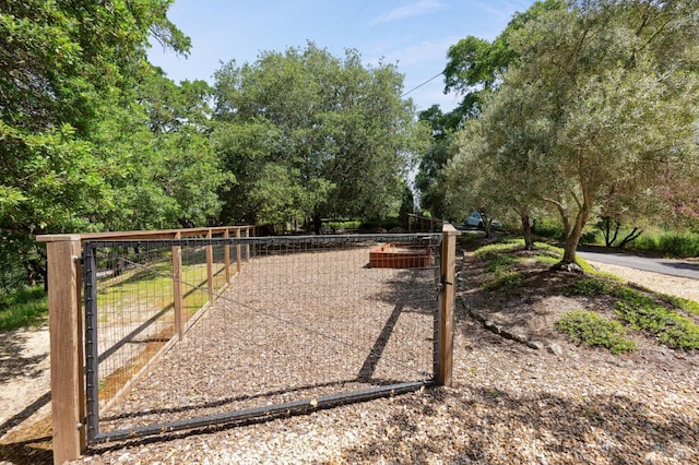 view of gate with fence