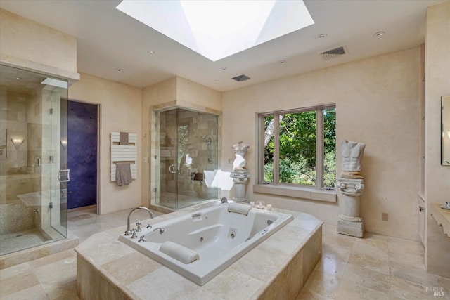 bathroom with a skylight, a whirlpool tub, a stall shower, and visible vents