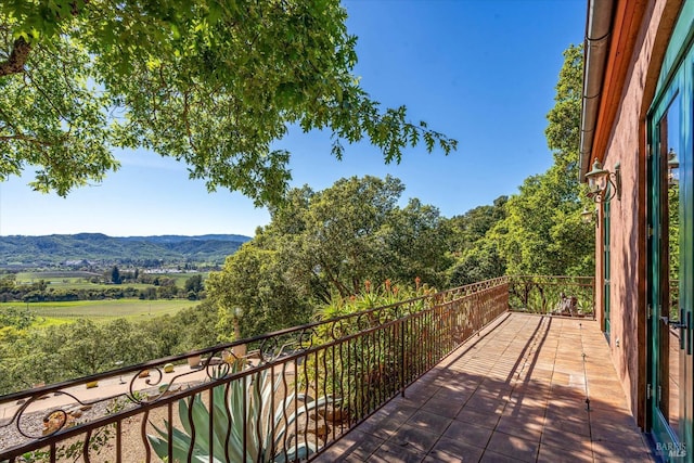balcony featuring a mountain view