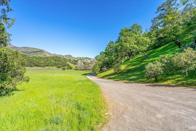 view of street featuring a rural view and a mountain view