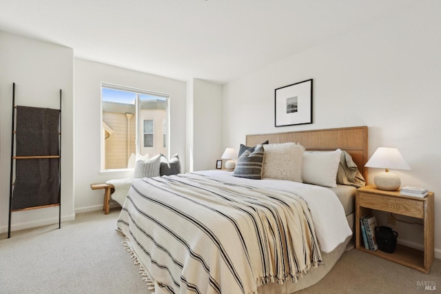 carpeted bedroom with baseboards