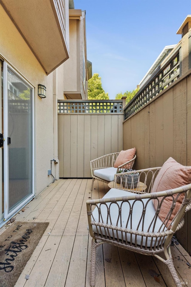 view of patio featuring a balcony