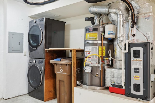 laundry room with secured water heater, stacked washer and clothes dryer, laundry area, and electric panel