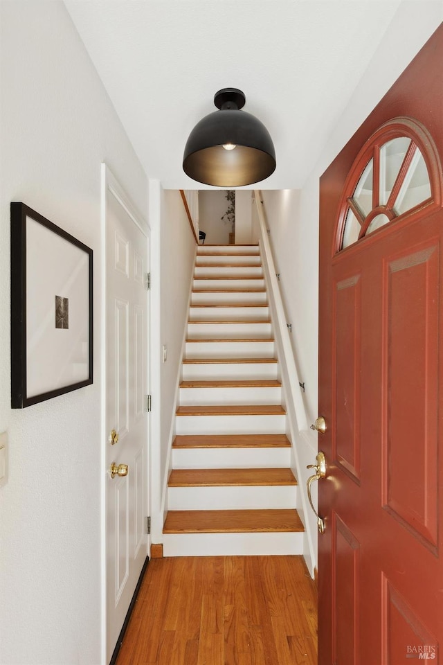 entryway with stairs and light wood-type flooring