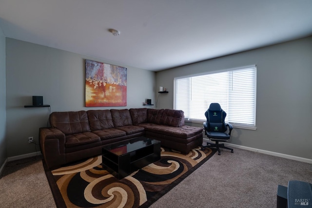 carpeted living room with baseboards
