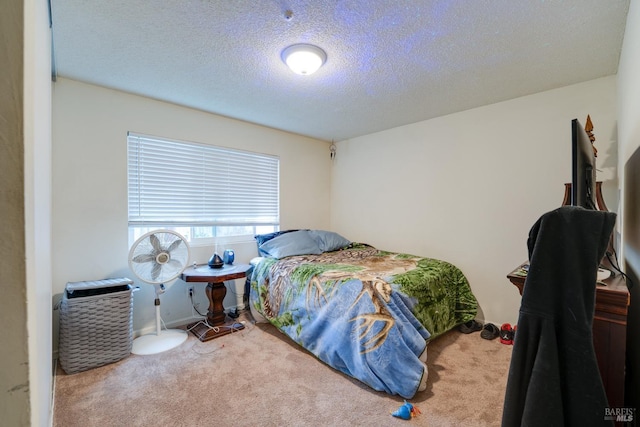 carpeted bedroom with a textured ceiling