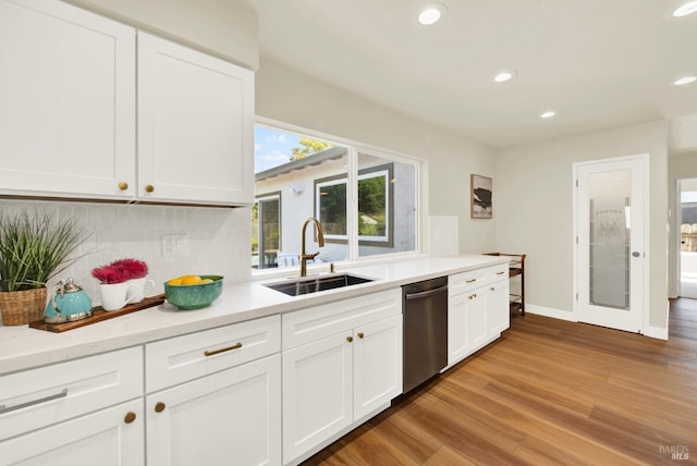 1426 Shelby Dr, Fairfield, CA 94534 - kitchen featuring stainless steel dishwasher, a sink, recessed lighting, light wood-type flooring, and tasteful backsplash