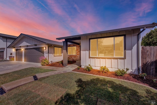1426 Shelby Dr, Fairfield, CA 94534 - view of front of home with board and batten siding, a garage, and concrete driveway