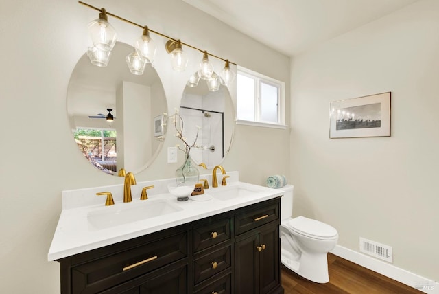 bathroom featuring a sink, plenty of natural light, and visible vents