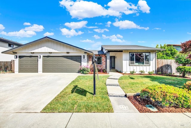 1426 Shelby Dr, Fairfield, CA 94534 - view of front of house with board and batten siding, an attached garage, and concrete driveway