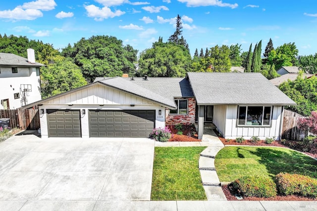 1426 Shelby Dr, Fairfield, CA 94534 - view of front of house featuring board and batten siding, an attached garage, concrete driveway, and roof with shingles