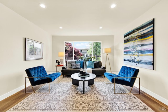 sitting room featuring wood finished floors, baseboards, and recessed lighting