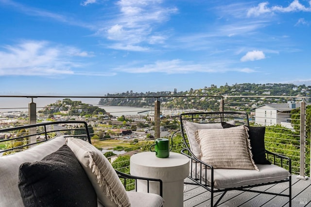 balcony featuring a water view