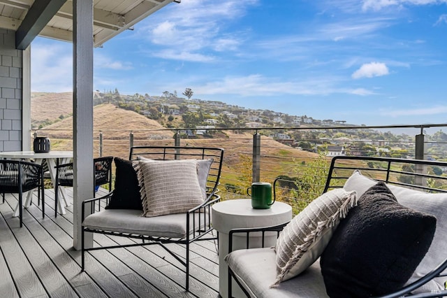 balcony featuring a mountain view