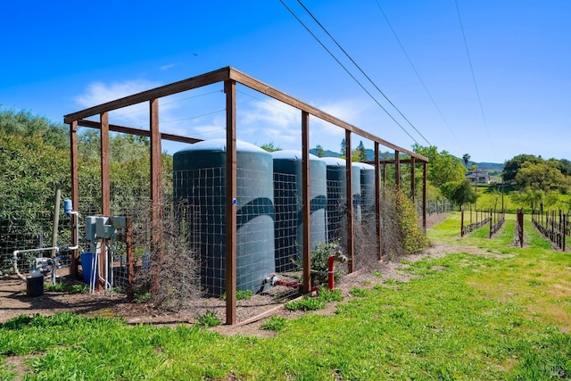 view of outdoor structure featuring fence