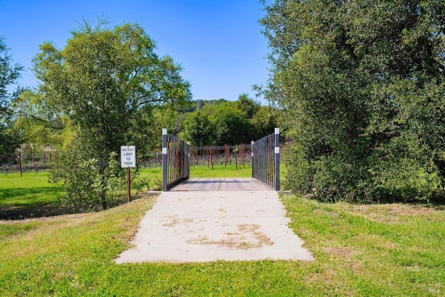 view of gate with fence
