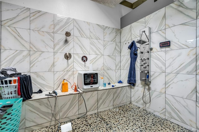 full bath featuring heating unit and a tile shower