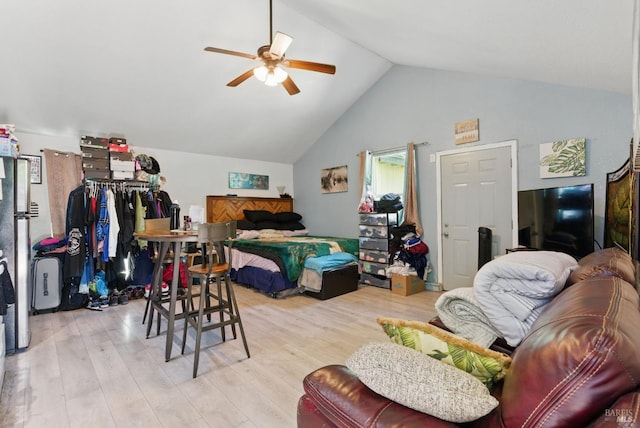 bedroom featuring high vaulted ceiling, a ceiling fan, and light wood-type flooring